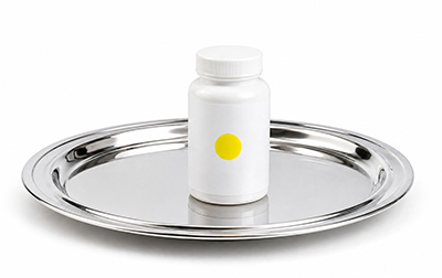 Minimalist supplement bottle on silver platter